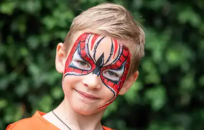 Face painting for kids, transforming into a tiger, superhero, or fairy